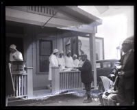 Nurses gathered at a front porch after the collapse of the Saint Francis Dam, Santa Clara River Valley (Calif.), 1928