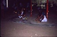 Sarpam Thullal Pulluvan Serpent Ritual - two Nair women on a ritual drawing, Peramangalam (India), 1984