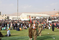 People holding Kurdistan flag