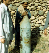 Mujahideen Stands With Unexploded Bomb