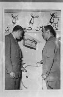 Snapshot of Gamal Abdel Nasser inspecting a Tiger washing machine