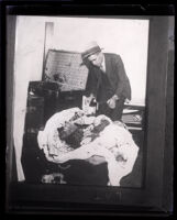 Police Detective examines the contents of a trunk used by Winnie Ruth Judd to ship a corpse, Los Angeles, 1931 
