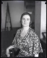 Bertha K. Bixby seated in a wooden chair for a photograph, Long Beach, circa 1930