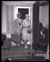 Minnie Kennedy and her husband Guy Edward Hudson enter a home, United States, circa 1931-1932