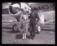 Pilot Herbert J. Fahy and his wife Claire in front of a Lockheed monoplane, Los Angeles, 1929