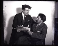 Writers Jim Tully and Konrad Bercovici discuss the latter's manuscript, Los Angeles, 1922