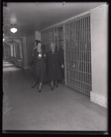 Winnie Ruth Judd, murder suspect, escorted from her cell by Deputy Sheriff Belle DeWolfe, Los Angeles, 1931