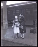 Opera singer Mademoiselle Rosa Raisa is met by opera singer Mary Fabian at the train station, Los Angeles, 1929