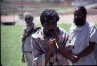 Kota musician, Pukali, plays a pulāng (?), Ticgār (Trichagadi, India), 1984