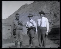 Three engineers or geologists in the canyon after the collapse of the Francis Dam, San Francisquito Canyon (Calif.), 1928