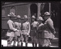 California National Guard 160th Infantry standing next to a train, Los Angeles, 1924