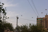 Helicopters carrying Kurdish flag above Sulaimani Stadium