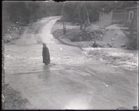 F. W. Arlin on a flooded dirt road in the Arroyo Seco, Pasadena (vicinity), 1930-1939