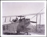 Two people seated in a small biplane, San Pedro, 1920s