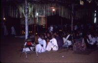 Sarpam Thullal Pulluvan Serpent Ritual - families seated at the edge of the ritual space, Peramangalam (India), 1984