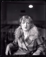 Edith Andrews seated in a courtroom alone during her divorce from film director Del Andrews, Los Angeles, 1928