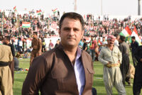 A man wearing Kurdish clothes