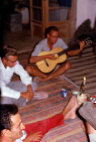 Dupree Playing Guitar in House at Aq Kupruk