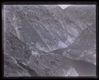 Top view of water running through mountains behind the Pacoima Dam, Los Angeles County, circa 1928