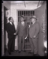 Jailer Clem Peoples, prisoner Asa Keyes and Sheriff Frank Cochran at the county jail, Los Angeles, 1930 