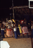Theyyam festival - Darika-Danavendra: two male theyyam dancers have costumes adjusted, Kalliasseri (India), 1984