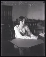 Eunice Pringle sitting with her arms on a desk, Los Angeles, 1929