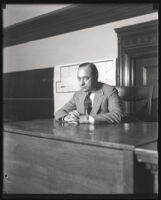 Jacob Berman seated at a courtroom table, Los Angeles, 1928-1930