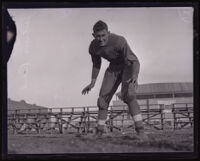 College football player Julius Beck crouching, Los Angeles, 1926