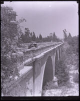 Automobile riding on Colorado Street Bridge, Pasadena, circa 1920s