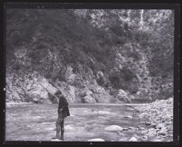 Man standing by a stream, Pasadena, 1920s