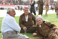 Three old men wearing Kurdish clothing