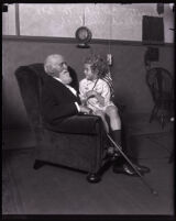 Cornelius Cole seated with child actor Richard Headrick, Los Angeles, 1920s