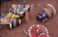 Ona Villu Kottu - six carved wooden masks used in an Ona Villu Kottu on palmwood bows at the Casino Hotel, Thrissur (India), 1984