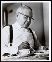 Louis M. Blodgett eating, circa 1950