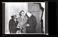 Jean De la Cour gives Biddy Mason plaque to Mason's great-great-great-granddaughter at the Natural History Museum, Los Angeles, 1957