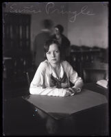 Eunice Pringle sitting with arms on a desk, Los Angeles, 1931