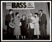 Charlotta Bass given flowers at a campaign rally when she was a candidate for Congress in the 14th District, Los Angeles, 1950