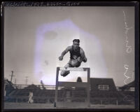 Otto Anderson soars over a hurdle, Los Angeles, 1922-1926