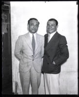 Boxer Tony Canzoneri standing next to an unidentified man, Los Angeles County, 1931