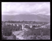 Colorado Street Bridge with San Gabriel mountains in background, Pasadena,1920s