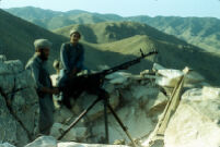 Two Mujahids With Machine Gun in Trench