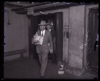 Asa Keyes leaving the county jail on his way to San Quentin Prison, Los Angeles, 1930