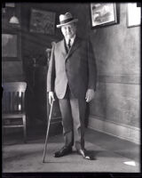 Henry J. Allen, governor of Kansas stands with cane, circa 1919