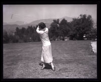 Golfer Dorothy Richards swings her club at the Flintridge Country Club, La Cañada, 1925
