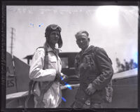 Parachutist Frank Austin and parachute inventor Heard McClellan in an airfield, Los Angeles, 1926