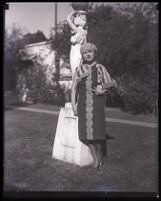 Millicent Sunday Standing in front of a garden statue in a park or yard, Los Angeles, 1928 