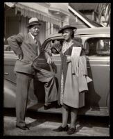 Drs. John and Vada Somerville standing beside a car, 1930s