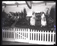Two women in front of Garden Grove's exhibit at the Orange County Fair, Orange County, 1928