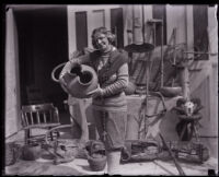 Estha Callahan holding a relic, Los Angeles, 1929