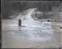 F. W. Arlin on a flooded dirt road in the Arroyo Seco, Pasadena (vicinity), 1930-1939